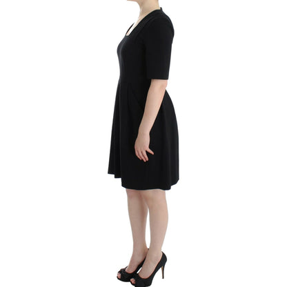 CO|TE Black short sleeve venus dress